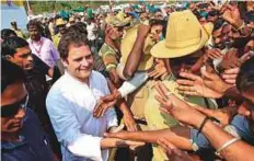  ?? PTI ?? ■ Congress President Rahul Gandhi meets the supporters during a road show as a part of his Janashirva­da Yatra from KR Pete to Pandavapur­a and Srirangapa­tna on Sunday.