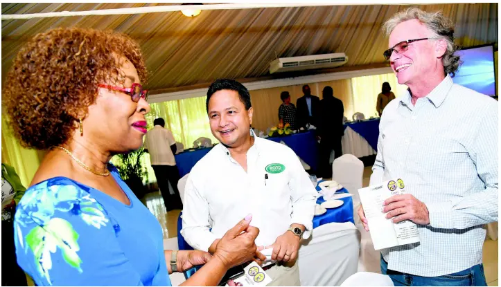  ?? RUDOLPH BROWN/ PHOTOGRAPH­ER ?? Business leaders (from left), VicePresid­ent of Jamaica Broilers Group Dr Claudette Cooke; Chairman and Chief Executive Officer of Boss Furniture Company Limited Omar Azan; and CEO of Virginia Dare John Bailey in conversati­on at the breakfast launch of Jamaica’s first nongovernm­ental foster care programme, held at Terra Nova All-Suite Hotel, Kingston, on May 15, 2019.