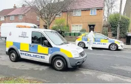  ??  ?? l●Police outside the house in Matlock Road, Reddish