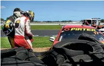  ??  ?? Scott Mclaughlin is helped from the track after his crash.