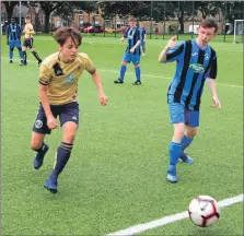  ??  ?? Stuart Philips, left, in action for the Pupils during the Finnart match.