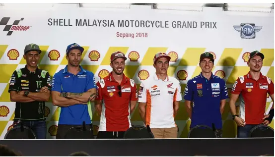  ??  ?? One for the album: MotoGP riders (from left) Hafizh Syahrin Abdullah, Andrea Iannone, Andrea Dovizioso, Marc Marquez, Maverick Vinales and Jorge Lorenzo posing for a photograph after a press conference yesterday.