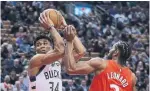  ?? STEVE RUSSELL TORONTO STAR ?? Toronto’s Kawhi Leonard defends against Milwaukee forward Giannis Antetokoun­mpo.