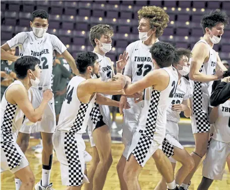  ?? Andy Cross, The Denver Post ?? The ThunderRid­ge Grizzlies celebrate their Colorado State 5A championsh­ip victory at the Broadmoor World Arena late Saturday.