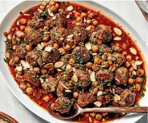  ?? THE WASHINGTON POST ?? To serve, top Algerian meatballs with toasted almonds and parsley.