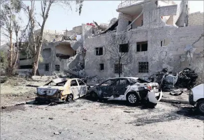  ?? PICTURE: REUTERS ?? Damaged cars at one of the blast sites in Damascus.