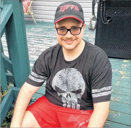  ?? ROSIE MULLALEY/THE TELEGRAM ?? Shaughn Connors, shown here at his St. John’s home Friday, was determined to compete in the 2018 Special Olympics National Summer Games, so he lost close to 60 pounds by training hard and eating right.