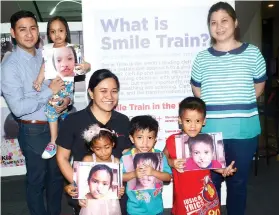  ?? SUNSTAR FOTO/ALLAN TANGCAWAN ?? BENEFICIAR­IES. The kid-beneficiar­ies pose with Kimmy Coseteng-Flaviano (center, second row), Smile Train country director, and doctors from its hospital partners.