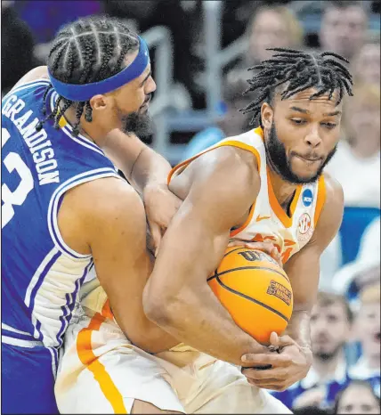  ?? Chris O’meara The Associated Press ?? Guard Josiah-jordan James and his Tennessee teammates have been aggressive on both ends of the court in winning their first two games in the tournament.