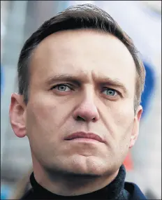  ?? PAVEL GOLOVKIN/AP ?? Russian opposition activist Alexei Navalny takes part in a march in memory of opposition leader Boris Nemtsov on Feb. 29 in Moscow. The German hospital treating Navalny says tests indicate that he was poisoned.