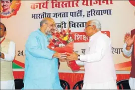  ??  ?? Haryana chief minister Manohar Lal Khattar greeting BJP president Amit Shah at a party function in Kurukshetr­a on Sunday. HT PHOTO