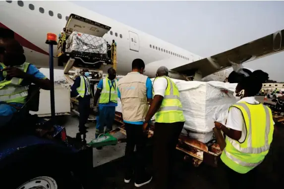  ?? (Unicef/AP) ?? The first shipment of Oxford-AstraZenec­a jabs arrives at the airport in Accra