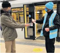  ??  ?? ●●Hand sanitising as part of Metrolink’s safety campaign