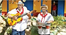  ?? Picture: EPA/EFE ?? STREET BEAT. Musicians at Hacienda Guachinang­o in Cuba.