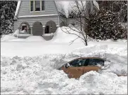  ?? NEWYORK STATE POLICE PHOTOS VIA AP ?? NewYork State Police Sgt. Jason Cawley rescued Kevin Kresen, 58, fromthis car Thursday, where he spent 10 hours buried under 4 feet of snowafter hewas “plowed in by a truck.”