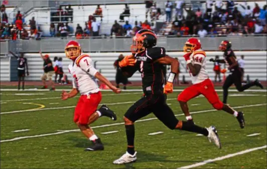  ?? BILL RUDICK — FOR DIGITAL FIRST MEDIA ?? Chester’s Malik Langley dashes downfield as Haverford’s Jake Ruane, left, and Chasen Wint give chase Saturday night in a seasonopen­ing game between the teams at Lincoln University.