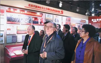  ?? FENG YONGBIN / CHINA DAILY ?? Delegates from foreign political parties and organizati­ons visit the Party School of the Central Committee of the Communist Party of China in Beijing on Friday. They are in the city to attend a high-level internatio­nal interparty dialogue.