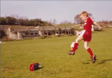  ??  ?? May, 1990: Dean Goodison enjoying a kickabout with his father, Michael, in Crystal Palace Park, with the palace in the background. Dean was six, soon to be seven, and Liverpool had just clinched the Division 1 title: to the club had commenced.