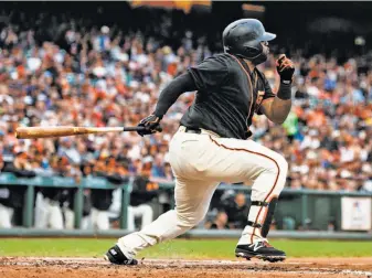  ?? Jason O. Watson / Getty Images ?? Pablo Sandoval went 1-for-3, his leadoff double in the seventh sparking a three-run rally in his first game back in a San Francisco uniform.