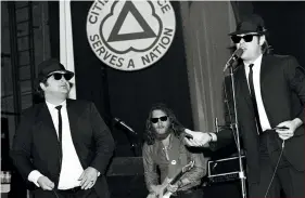  ??  ?? CLOCKWISE FROM LEFT: With Otis Redding, Hunter College, New York City, January 21, 1967. With Neil Young, August 24, 1993. Onstage with the Blues Brothers’ Dan Aykroyd and John Belushi at the Palladium, New York City, June 1, 1980