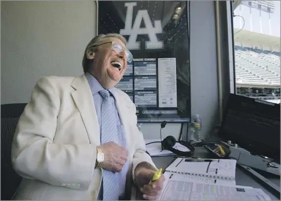  ?? Gary Friedman Los Angeles Times ?? VIN SCULLY in the booth at Dodger Stadium in 2010, above. He retired in 2016 after 67 years of being a broadcaste­r. Top left, Scully with announcing partner Jerry Doggett in 1985 at spring training in Florida. Top right, Scully in 2001 looks at the Wall of Fame at the Dodger Stadium press room that is named after him.