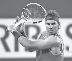  ?? - AFP photo ?? Rafael Nadal of Spain plays a backhand against Jared Donaldson of the United States during their men’s singles second round match on day seven of the BNP Paribas Open at the Indian Wells Tennis Garden in Indian Wells, California.