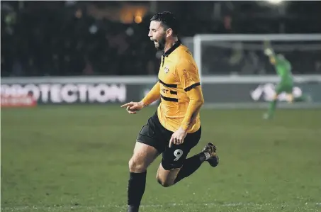  ??  ?? Padraig Amond celebrates after scoring Newport County’s second goal against Middlesbro­ugh at Rodney Parade last night.