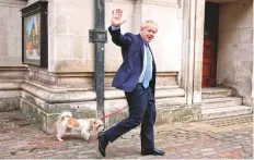  ?? AP ?? Johnson leaves with his dog Dilyn after voting at a polling station in London, for local council elections yesterday.