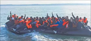  ?? ?? This photo provided by the Prefecture Maritime du Nord et de la Manche shows migrants continuing their journey to Britain off the northern France coast.