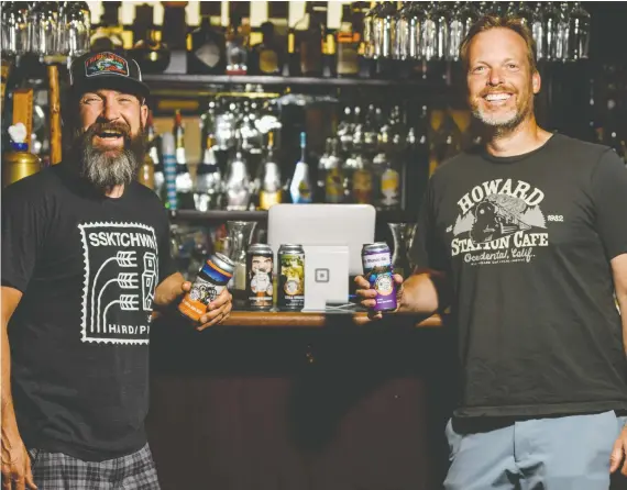  ?? AZIN GHAFFARI ?? One for the Road Brewing founders Graham Matheos and Kevin Young enjoy a cool one at Civic Tavern. Their products are sold in 120 retail stores, bars and restaurant­s,