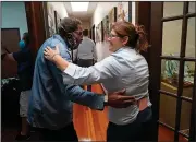  ?? (AP/Gerald Herbert) ?? Henry Montgomery is greeted by staffer Cristi Cheramie at the Louisiana Parole Project offices in Baton Rouge after his release from the Louisiana State Penitentia­ry.