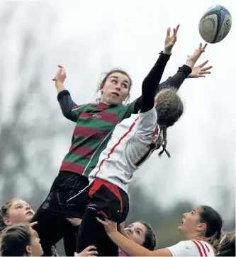  ?? CLIFFORD SKARSTEDT/THE EXAMINER ?? Holy Cross Hurricanes' Morgan Gullekson, left, fights for the ball in a lineout against Bayside during first half COSSA junior AA girls' rugby championsh­ip action on Nov. 2 at Holy Cross Secondary School in Peterborou­gh. Holy Cross edged Bayside 12-10.