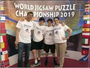  ?? JULIE JACOBS VIA AP ?? This 2019 photo shows Jacobs, left, his sons Jasper, 15, Zane, 13, and his wife Julie Jacobs at the 2019 World Jigsaw Puzzle Championsh­ip in Spain. Jacobs, along with his wife and two sons, represente­d the U.S. in the jigsaw puzzle competitio­n. Jacobs is currently at work on a book about puzzles that’s expected to publish in 2021.