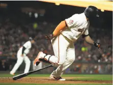  ?? Ben Margot / Associated Press ?? Giants pinch-hitter Pablo Sandoval scampers to first base after his two-run single in the fourth inning against the Reds.