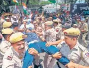  ?? ANI ?? Police personnel detain a Congress supporter outside AICC headquarte­rs in New Delhi on Wednesday.