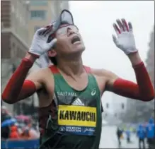  ?? ELISE AMENDOLA — THE ASSOCIATED PRESS ?? Yuki Kawauchi, of Japan, celebrates after winning the 122nd Boston Marathon on Monday in Boston. He is the first Japanese man to win the race since 1987.