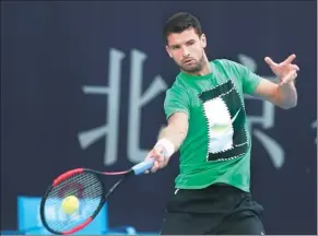  ?? PROVIDED TO CHINA DAILY ?? Grigor Dimitrov of Bulgaria, ranked eighth in the world, hits a return during practice for the China Open at the National Tennis Center in Beijing on Thursday.