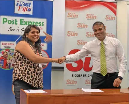  ?? Photo: Frederica Elbourne ?? Fiji Sun finance manager Jyotishna Chand and Post Fiji chief executive officer Anirudha Bansod after the signing of the MOU agreement on May 28,2020.