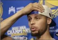  ?? THE ASSOCIATED PRESS ?? Golden State Warriors’ Stephen Curry places his hand to his head during a news conference Monday. The Warriors lost to the Cleveland Cavaliers in Game 7 of basketball’s NBA Finals on Sunday.
