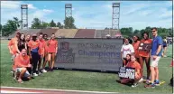  ?? Maggie Vanoni / Hearst Connecticu­t Media ?? Danbury celebrates winning the Girls Track and Field State Open championsh­ip on Thursday at Willow Brook Park in New Britain.