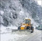  ?? HT PHOTO ?? A snow-cutter at work on Dhalli-kufri road in Shimla after a fresh spell of snow on Friday.