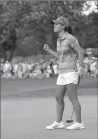  ?? The Associated Press ?? CELEBRATIN­G THE WIN: Danielle Kang reacts after making birdie on the 18th green to win the Women’s PGA Championsh­ip golf tournament at Olympia Fields Country Club Sunday in Olympia Fields, Ill.