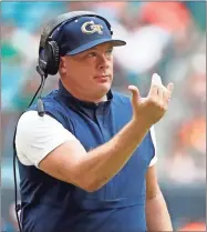  ?? AP-Wilfredo Lee, File ?? Georgia Tech head coach Geoff Collins gestures during the first half of an NCAA college football game against Miami in Miami Gardens, Fla. With doubts still hanging over the season because of the coronaviru­s pandemic, Georgia Tech begins practice for Year 2 under coach Geoff Collins.