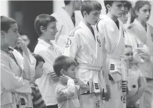  ?? DAN JANISSE ?? Students listen up during a training session at Windsor’s Hybrid Training Academy.