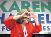  ?? Curtis Compton Atlanta Journal-Constituti­on ?? ALTHOUGH Karen Handel, Georgia’s former secretary of state, distanced herself from President Trump, her election victory is a political win for him.