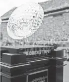  ??  ?? The AFCA Coaches Trophy presented by Amway will be awarded to the Bowl Subdivisio­n’s national champion during a live broadcast on Jan. 9.
JOSHUA S. KELLY/USA TODAY SPORTS