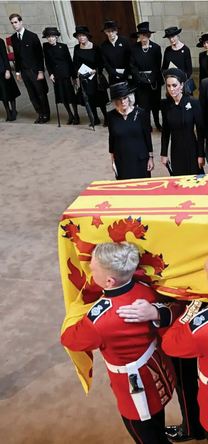  ?? ?? A nation’s loss: Queen Elizabeth II’s coffin is carried past the Queen Consort, the Princess of Wales, the Countess of Wessex and the Duchess of Sussex into Westminste­r Hall yesterday afternoon