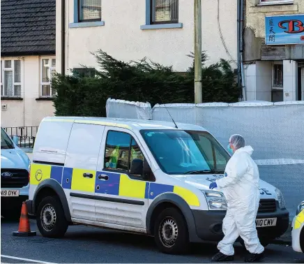  ??  ?? Police and scenes of crime officers outside the Blue Sky Chinese takeaway in Ynyswen, Treorchy