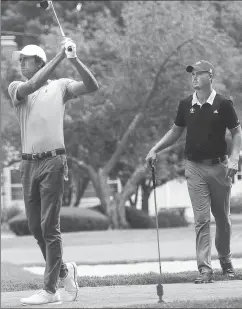  ?? Photo by Ernest A. Brown ?? Stewart James (left) tees off at No. 12 Friday during the thirrd round of the Northeast Am at Wannamoise­tt. James is 5-over headed into the final round.