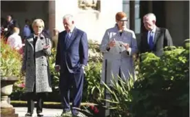  ??  ?? SYDNEY: US Secretary of State Rex Tillerson (second left), Australia’s Foreign Minister Julie Bishop (left), US Secretary of Defense Jim Mattis (right) and Australia’s Defense Minister Marise Payne (second right) take a garden walk at Government House...